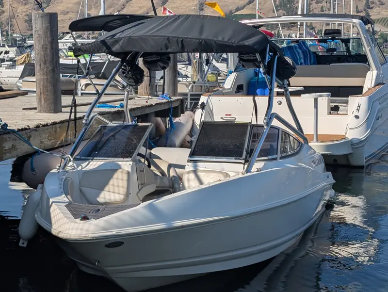 Bowrider boat tied to a dock