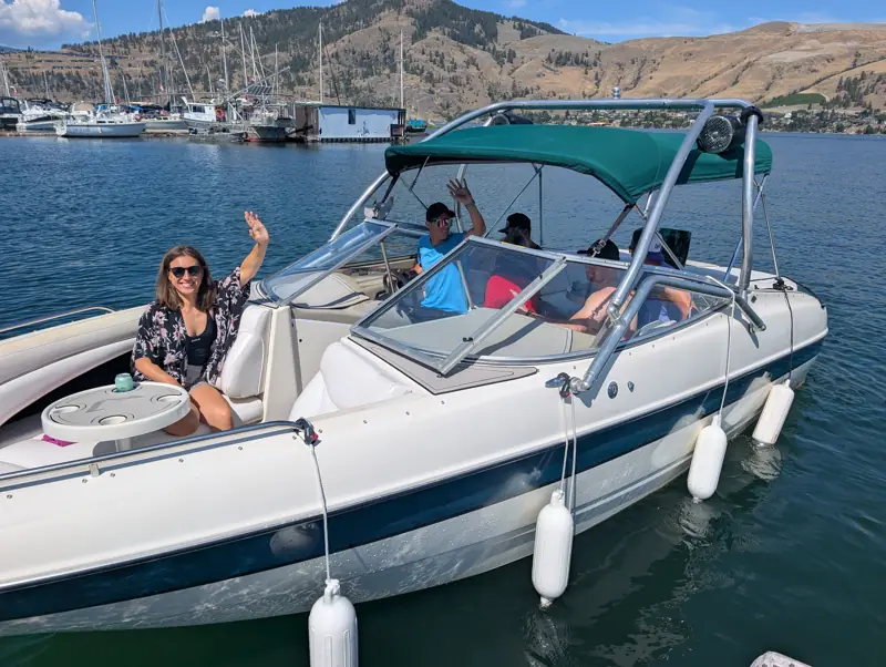 Family on a bowrider at a marina