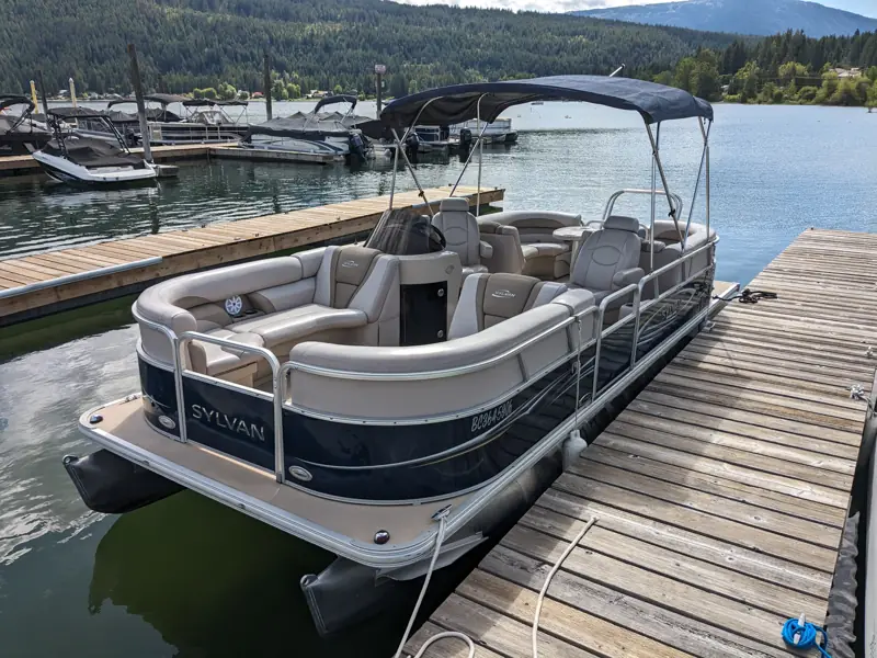 Pontoon boat at a dock on Okanagan Lake