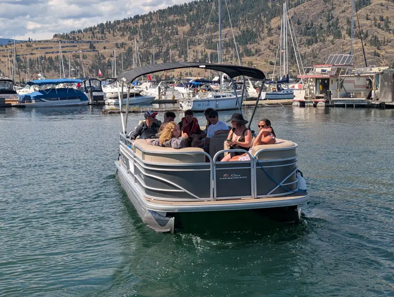 Group of friends on a pontoon boat